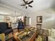 Inviting living room with elegant furnishings, hardwood floors, and an open layout connecting seamlessly to the kitchen at 142 Highland Dr, New London, NC 28127