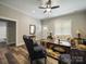 Well-lit living room with hardwood floors, a ceiling fan, and classic decor at 142 Highland Dr, New London, NC 28127