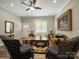 Inviting living room with ceiling fan, wood floors and traditional furnishings at 142 Highland Dr, New London, NC 28127
