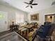 Comfortable living room with hardwood floors, natural light, and classic decor at 142 Highland Dr, New London, NC 28127