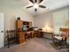 Home office featuring a classic wooden desk, carpet, and a comfortable rocking chair for a productive workspace at 142 Highland Dr, New London, NC 28127