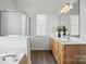 Bathroom with a double vanity sink, and glass enclosed shower at 146 Burtons Barn Rd, Mooresville, NC 28115