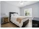 This bedroom features wood-look floors and a large window for natural light at 146 Burtons Barn Rd, Mooresville, NC 28115