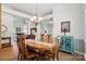 Open-concept dining room with dark wood flooring and natural light at 146 Burtons Barn Rd, Mooresville, NC 28115
