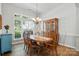 Bright dining room featuring wood flooring and an elegant chandelier at 146 Burtons Barn Rd, Mooresville, NC 28115