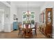 Formal dining room featuring wainscoting, hardwood floors, and a window with natural light at 146 Burtons Barn Rd, Mooresville, NC 28115