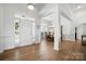 Bright foyer with hardwood floors, a front door with sidelights, and an adjacent dining area at 146 Burtons Barn Rd, Mooresville, NC 28115