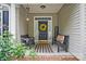 Inviting front porch area with comfortable seating, a decorative wreath, and a welcoming ambiance at 146 Burtons Barn Rd, Mooresville, NC 28115