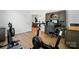 Home gym area with rowing machine, exercise bike, and desk with storage at 146 Burtons Barn Rd, Mooresville, NC 28115