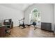 Home gym with exercise bike, rowing machine, and desk setup at 146 Burtons Barn Rd, Mooresville, NC 28115