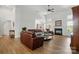 Spacious living room with hardwood floors, a fireplace, and ample natural light at 146 Burtons Barn Rd, Mooresville, NC 28115