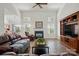 Bright living room features hardwood floors, fireplace, and natural light at 146 Burtons Barn Rd, Mooresville, NC 28115