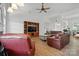 Open living area showcasing hardwood floors, a fireplace, and bright, natural light at 146 Burtons Barn Rd, Mooresville, NC 28115