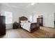 Bright main bedroom with wood floors and an en-suite bathroom at 146 Burtons Barn Rd, Mooresville, NC 28115