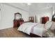 This is a spacious main bedroom with hardwood floors, trey ceiling, and traditional furniture at 146 Burtons Barn Rd, Mooresville, NC 28115