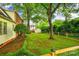 Spacious backyard features mature trees, green grass, and a wood fence at 1581 Granville Rd, Rock Hill, SC 29732