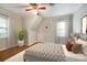 This bedroom features hardwood floors, natural light, and a ceiling fan at 1581 Granville Rd, Rock Hill, SC 29732