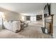 Spacious living room with built-in bookshelves, a fireplace, and a comfortable couch with a throw blanket at 1581 Granville Rd, Rock Hill, SC 29732