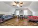 Loft living room featuring hardwood floors, natural light, and modern decor at 1581 Granville Rd, Rock Hill, SC 29732