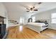 Spacious main bedroom with hardwood floors, a ceiling fan, and ample natural light from multiple windows at 1581 Granville Rd, Rock Hill, SC 29732