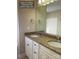 Bathroom with granite countertops, and sinks, and white cabinets at 1669 California Rd, York, SC 29745