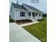 Charming single-story home with a welcoming front porch and well-manicured lawn at 1669 California Rd, York, SC 29745