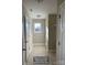 Hallway with tile floor, window, and white doors at 1669 California Rd, York, SC 29745
