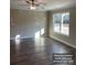 Bright and airy living room with hardwood flooring and a large window offering scenic views at 1669 California Rd, York, SC 29745