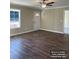 Bright living room with hardwood floors, large window, and neutral color palette, perfect for relaxation at 1669 California Rd, York, SC 29745
