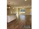 Spacious living room with hardwood floors, large windows, and an open layout at 1669 California Rd, York, SC 29745