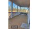 Covered porch with natural light, white railings, and wooden flooring at 1669 California Rd, York, SC 29745