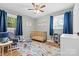 Cozy Bedroom with a rocking chair, crib, colorful rug and natural light at 206 Pelham Ln, Fort Mill, SC 29715