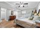 Cozy bedroom with a ceiling fan, wood floors, and lots of natural light at 206 Pelham Ln, Fort Mill, SC 29715