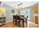 Formal dining room featuring stylish lighting and seating for six at 206 Pelham Ln, Fort Mill, SC 29715