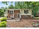 Charming two-story home with a mix of brick and siding, complemented by mature trees and flower boxes at 206 Pelham Ln, Fort Mill, SC 29715