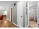 Hallway showcasing wood-look flooring, with a glimpse of the bathroom at 206 Pelham Ln, Fort Mill, SC 29715