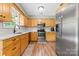Modern kitchen featuring stainless steel appliances, light wood cabinetry, and a bright, clean design at 206 Pelham Ln, Fort Mill, SC 29715