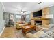 Comfortable living room with a stone fireplace, TV and an office nook at 206 Pelham Ln, Fort Mill, SC 29715