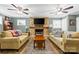 Inviting living room with a stone fireplace, TV, two sofas and natural light at 206 Pelham Ln, Fort Mill, SC 29715