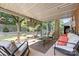 Relaxing screened porch area with comfortable seating, perfect for outdoor lounging and entertaining at 206 Pelham Ln, Fort Mill, SC 29715