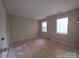 This bedroom has carpetless floors and bright windows at 2105 Killarney Pl, Charlotte, NC 28262