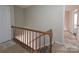 Hallway with carpeted stairs and railing at 2105 Killarney Pl, Charlotte, NC 28262