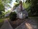 Traditional home with a brick chimney and established landscaping, situated on a nicely sized lot at 2105 Killarney Pl, Charlotte, NC 28262