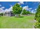 Spacious backyard featuring lush lawn and mature trees, creating a serene and private outdoor oasis at 217 Barberry Dr, Belmont, NC 28012