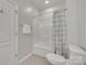 Clean bathroom with a tub, shower, toilet, and towel rack with modern fixtures at 217 Barberry Dr, Belmont, NC 28012