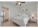 Light and airy bedroom featuring a comfortable bed, ceiling fan, and plenty of natural light at 217 Barberry Dr, Belmont, NC 28012