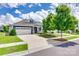 Charming two-story home featuring a three-car garage, well-manicured lawn, and inviting front porch at 217 Barberry Dr, Belmont, NC 28012