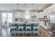 Modern kitchen with granite countertops, white cabinets, stainless steel appliances, and a large island at 217 Barberry Dr, Belmont, NC 28012
