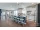Open-concept kitchen and dining area featuring a large island with bar seating and modern finishes at 217 Barberry Dr, Belmont, NC 28012