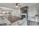 Open-concept living room with fireplace and dining area at 217 Barberry Dr, Belmont, NC 28012